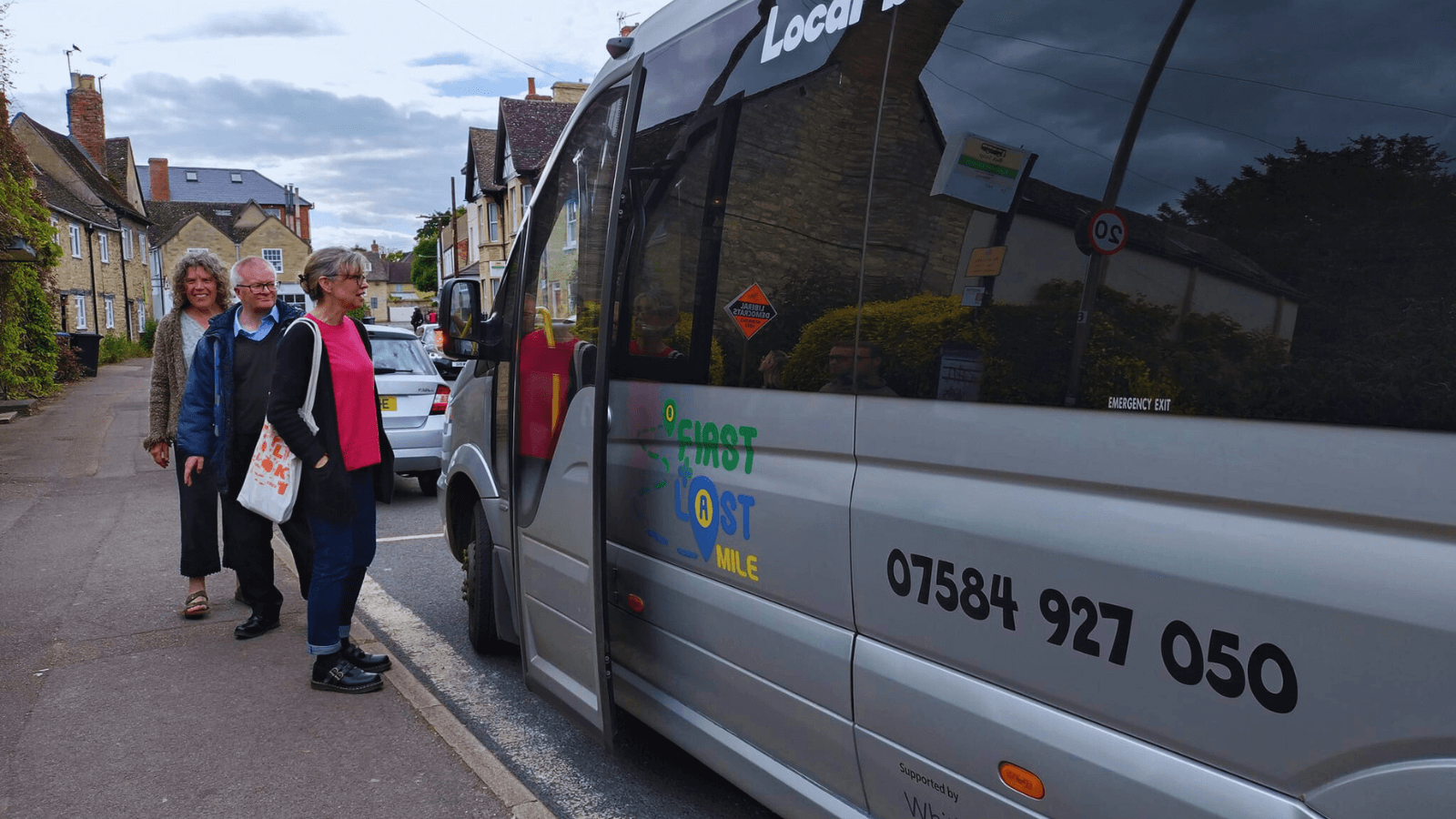 People queuing for a First and Last Mile bus.