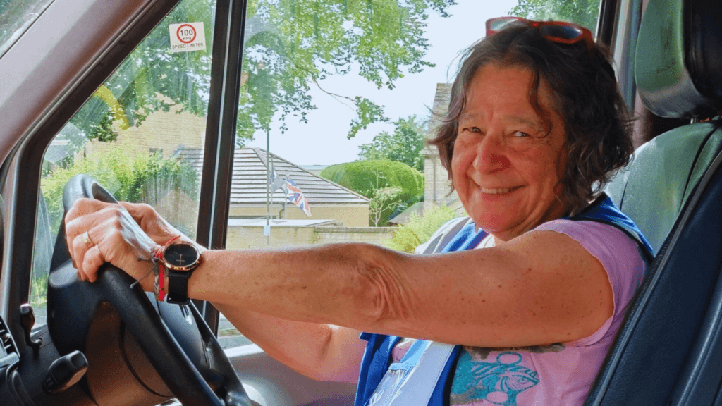 A female driver of a First and Last Mile bus.